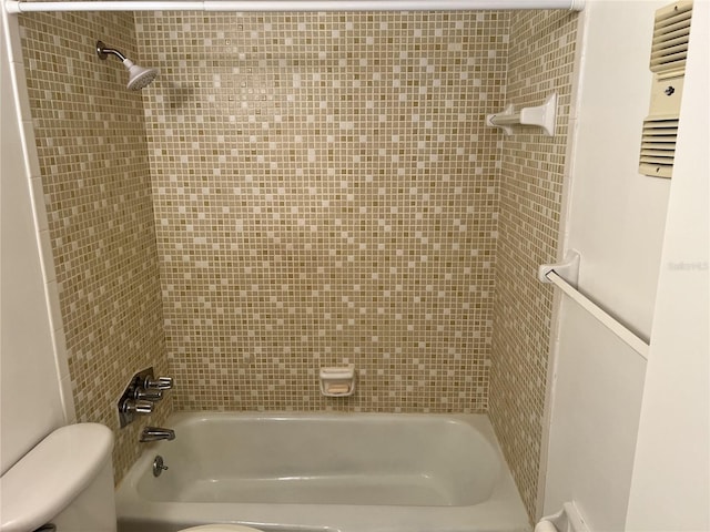 full bathroom featuring bathtub / shower combination and toilet