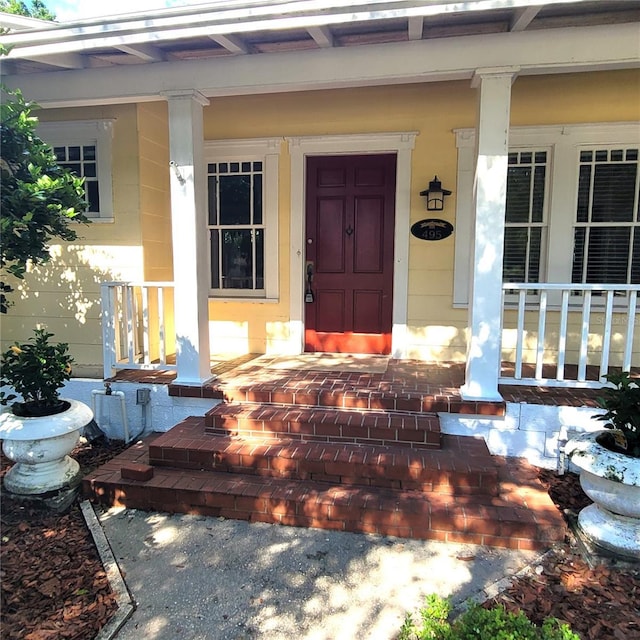 doorway to property with a porch