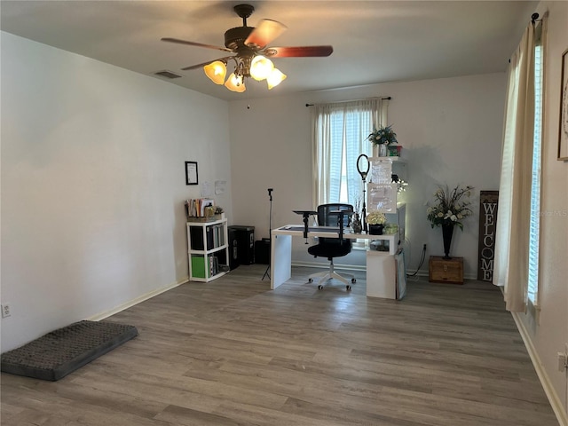 home office featuring ceiling fan and hardwood / wood-style flooring