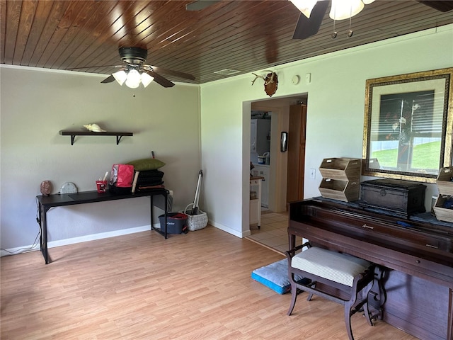 misc room with ceiling fan, light hardwood / wood-style floors, and wooden ceiling