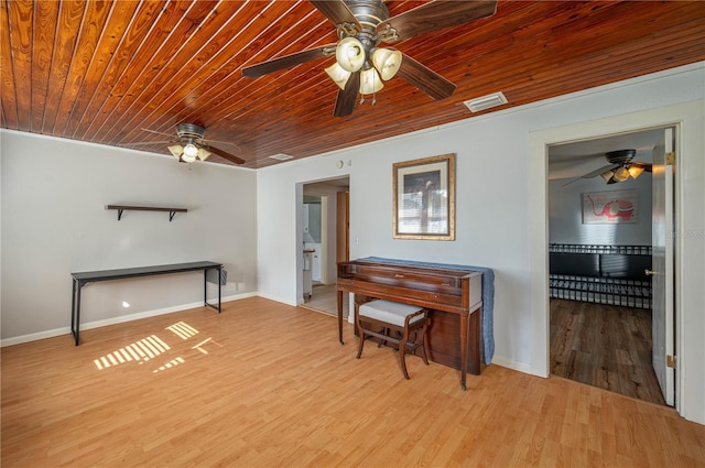 miscellaneous room with light hardwood / wood-style floors, ceiling fan, and wood ceiling