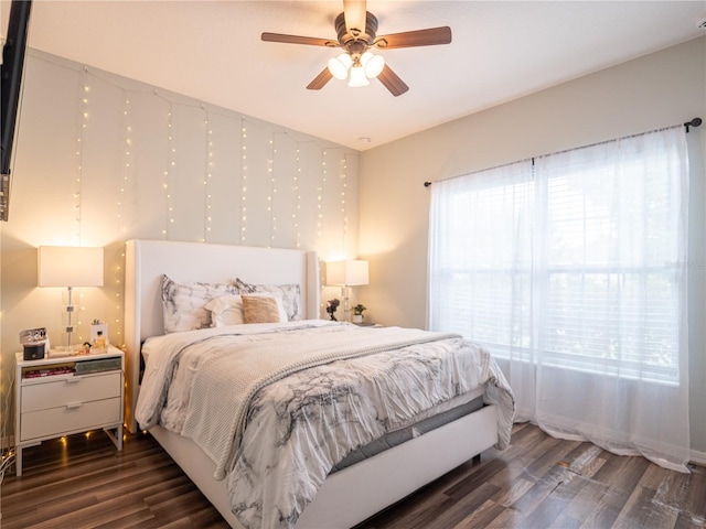 bedroom featuring ceiling fan and dark hardwood / wood-style flooring