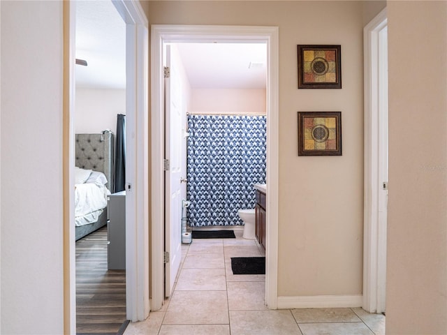 hallway featuring light tile patterned floors