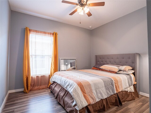 bedroom featuring ceiling fan and wood-type flooring