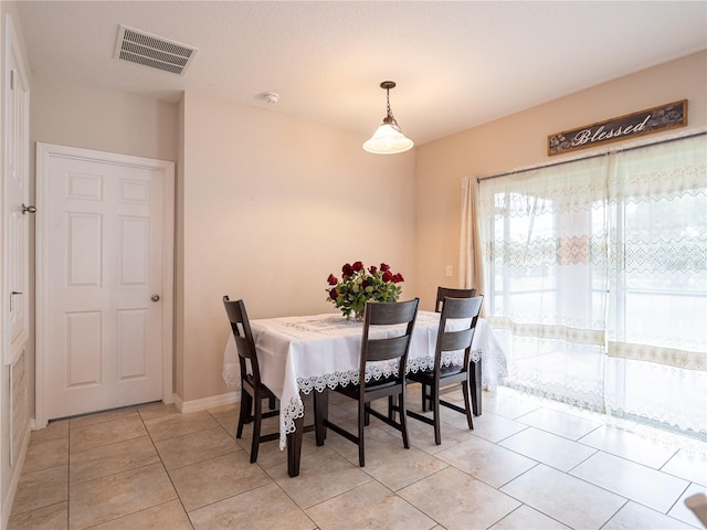 dining room featuring light tile patterned flooring