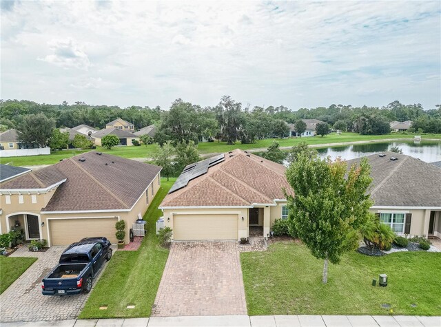 birds eye view of property with a water view