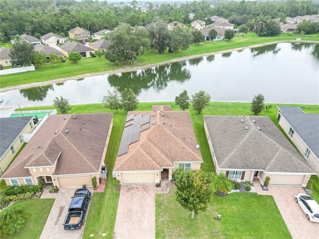 bird's eye view with a water view