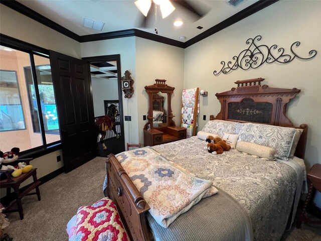 carpeted bedroom featuring ceiling fan and crown molding