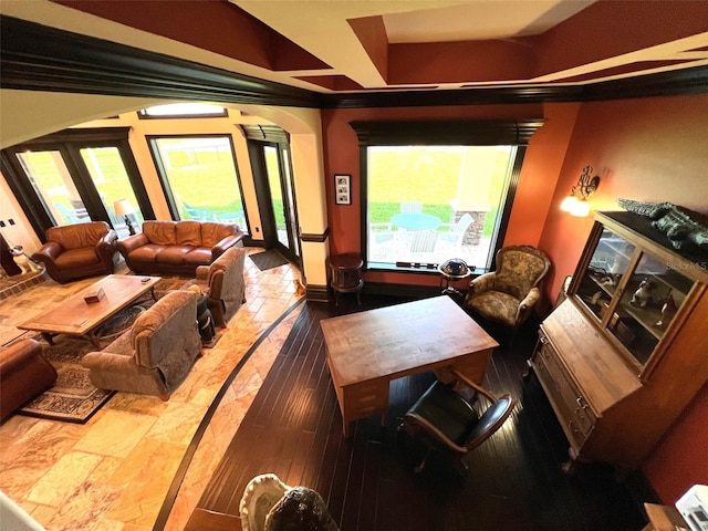 home theater featuring arched walkways and french doors