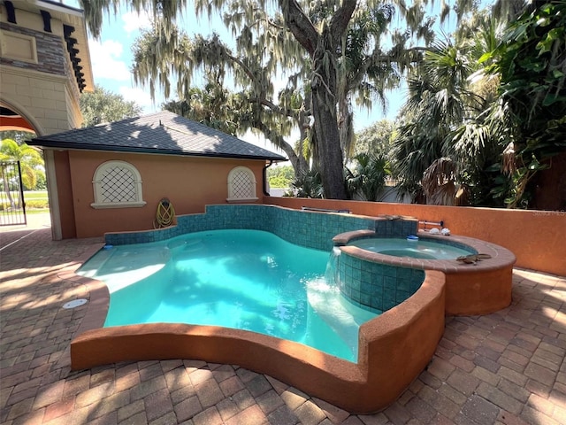 view of swimming pool featuring fence, a fenced in pool, and an in ground hot tub