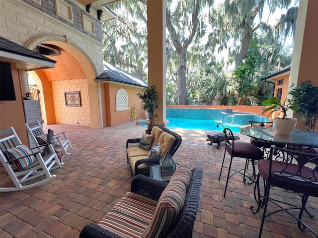 pool featuring an outdoor hangout area and a patio area