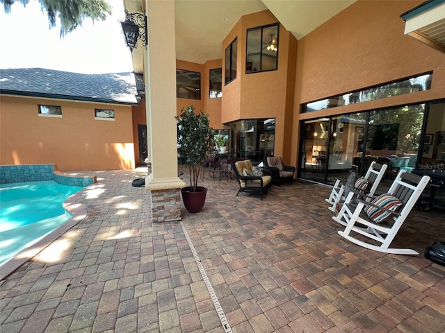 view of patio with an outdoor pool