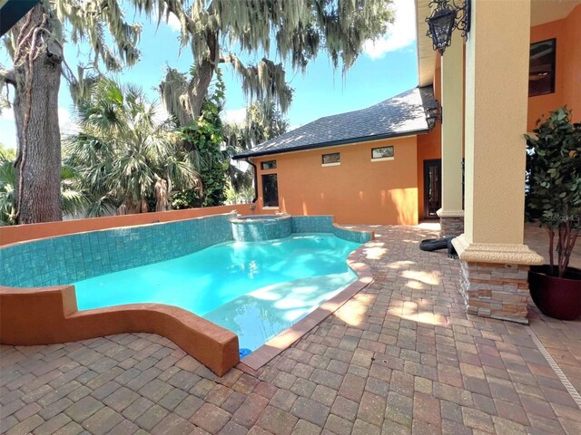 view of pool featuring a patio area