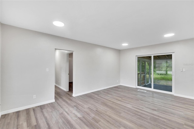 unfurnished room with light hardwood / wood-style flooring