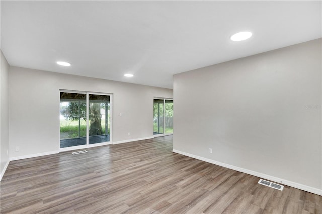 unfurnished room featuring wood-type flooring