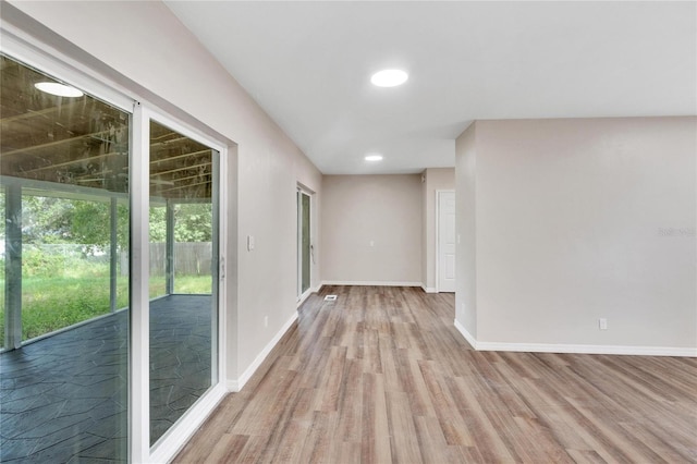 spare room featuring hardwood / wood-style floors