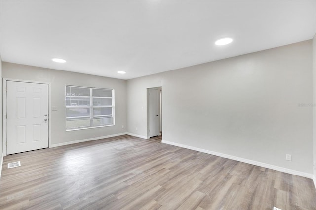 empty room with light wood-type flooring