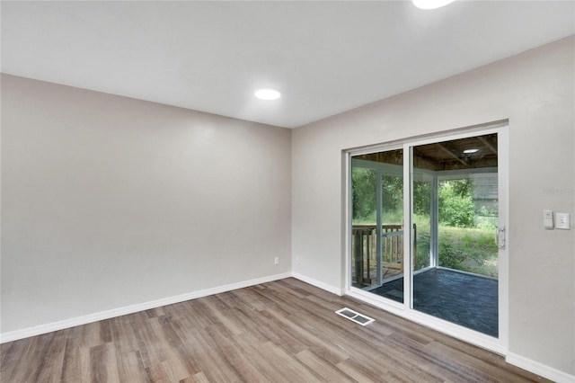 empty room featuring hardwood / wood-style floors