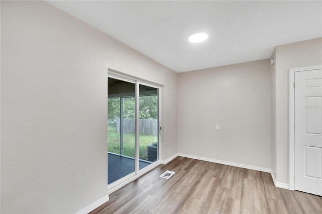 empty room with wood-type flooring