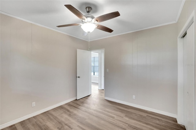 unfurnished bedroom featuring ornamental molding, ceiling fan, and light hardwood / wood-style floors