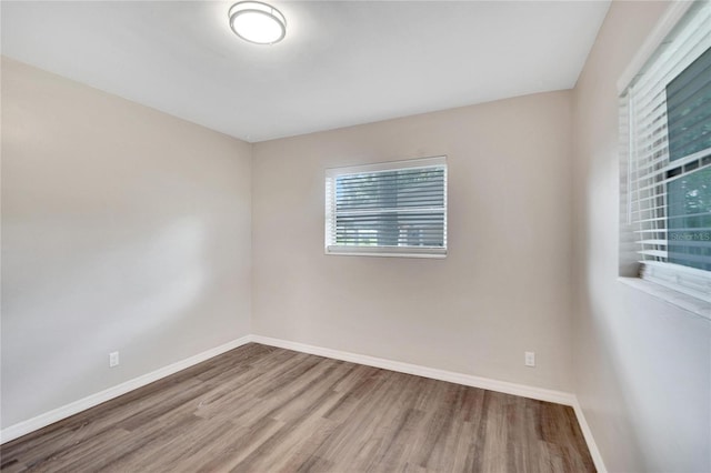 unfurnished room featuring wood-type flooring