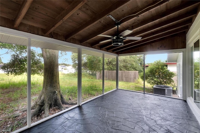 unfurnished sunroom with lofted ceiling with beams, ceiling fan, and wood ceiling