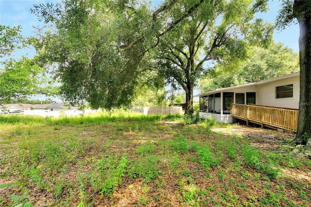 view of yard with a sunroom