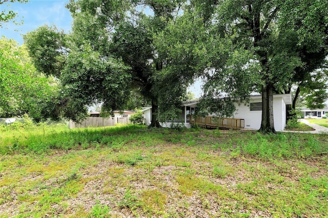 view of yard with a wooden deck