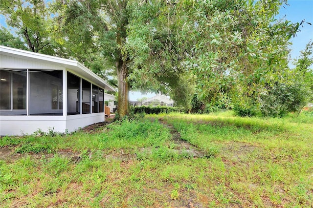 view of yard with a sunroom