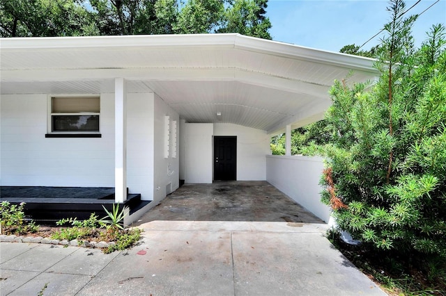 view of vehicle parking with a carport