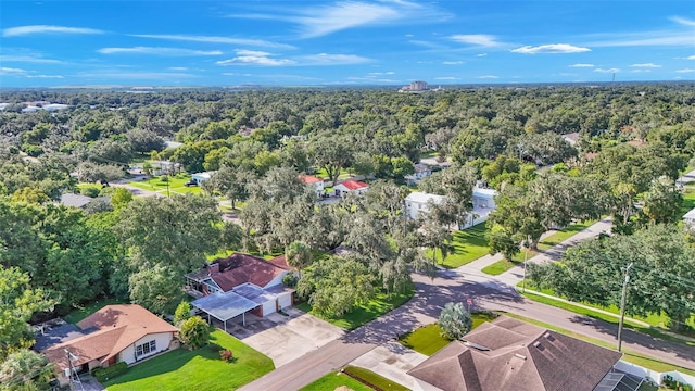 birds eye view of property with a forest view