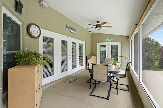 sunroom / solarium featuring ceiling fan, lofted ceiling, and french doors