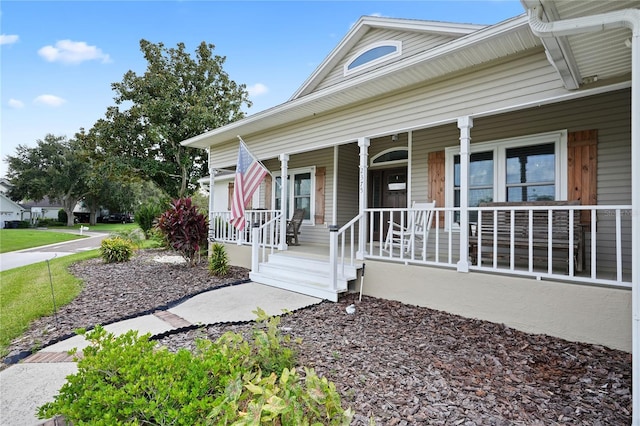 doorway to property featuring covered porch