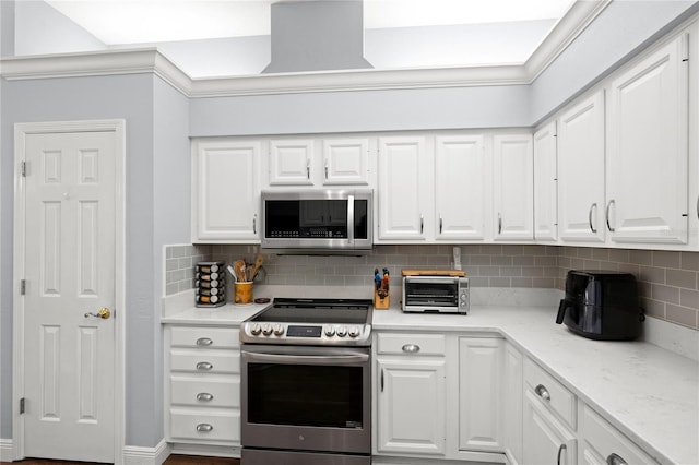 kitchen featuring decorative backsplash, light stone counters, white cabinetry, and stainless steel appliances