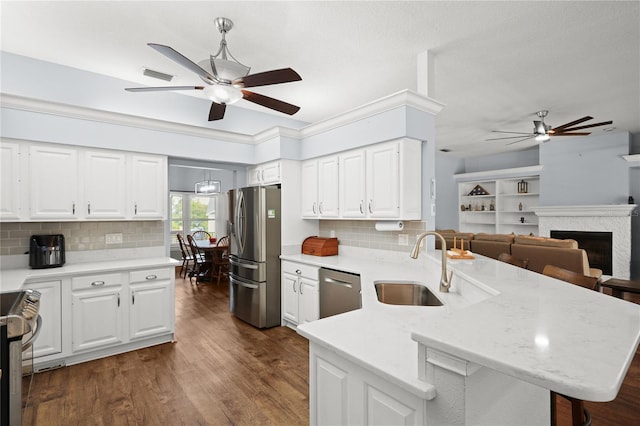 kitchen with white cabinets, stainless steel appliances, and sink