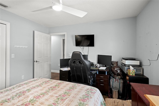 bedroom featuring hardwood / wood-style floors and ceiling fan