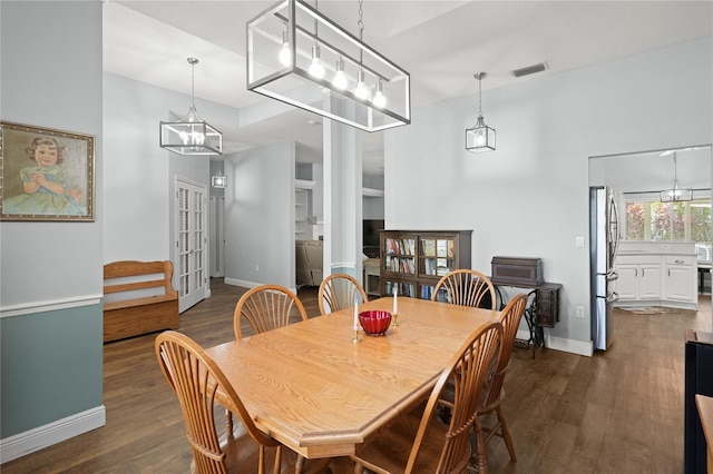 dining room featuring dark wood-type flooring