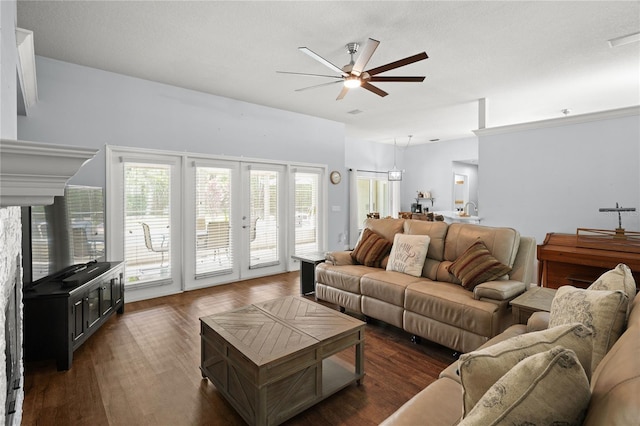 living room featuring ceiling fan and french doors