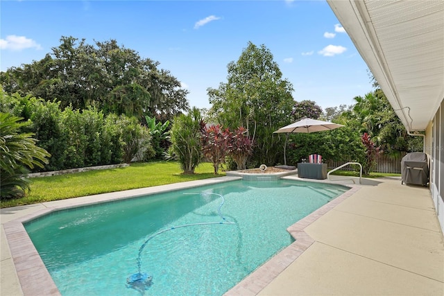 view of pool featuring a lawn and a patio