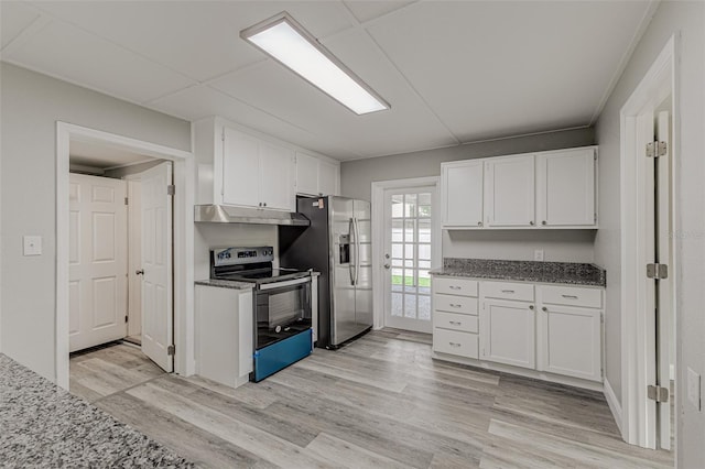 kitchen with light stone counters, appliances with stainless steel finishes, light hardwood / wood-style floors, and white cabinetry