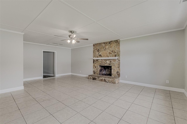 unfurnished living room with ornamental molding, ceiling fan, light tile patterned floors, and a stone fireplace