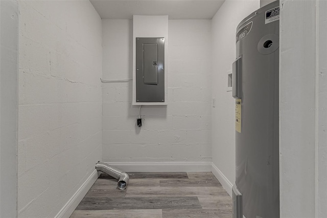 laundry room featuring electric water heater, electric panel, and light hardwood / wood-style floors