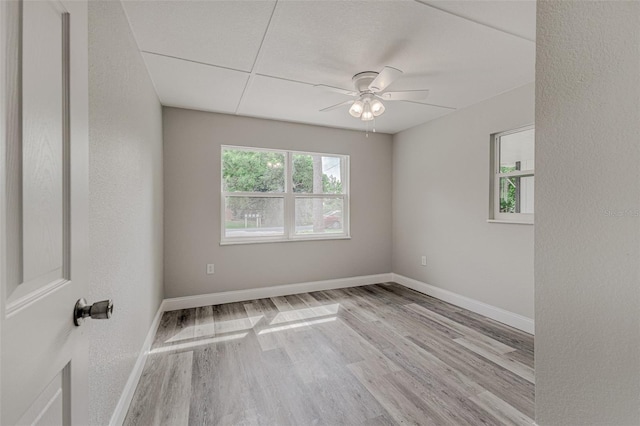 spare room featuring light hardwood / wood-style floors and ceiling fan