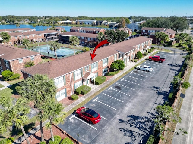 birds eye view of property with a water view