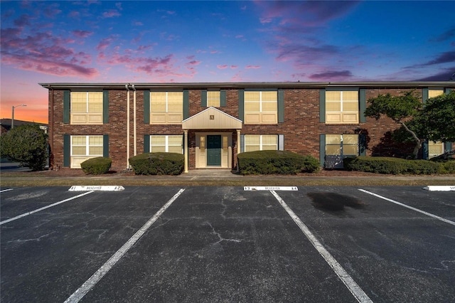 view of outdoor building at dusk