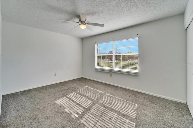 unfurnished room featuring carpet flooring, a textured ceiling, and ceiling fan