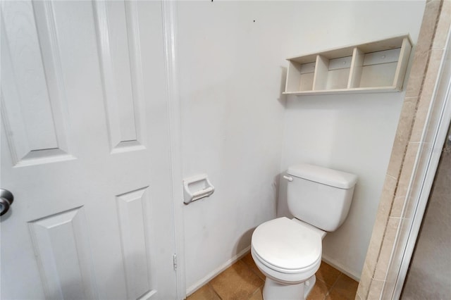 bathroom featuring tile patterned flooring and toilet