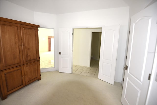 unfurnished bedroom featuring light colored carpet