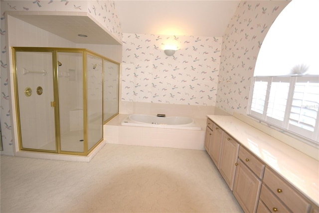 bathroom featuring plus walk in shower, lofted ceiling, and vanity