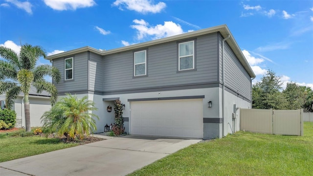 view of front facade with a garage and a front yard